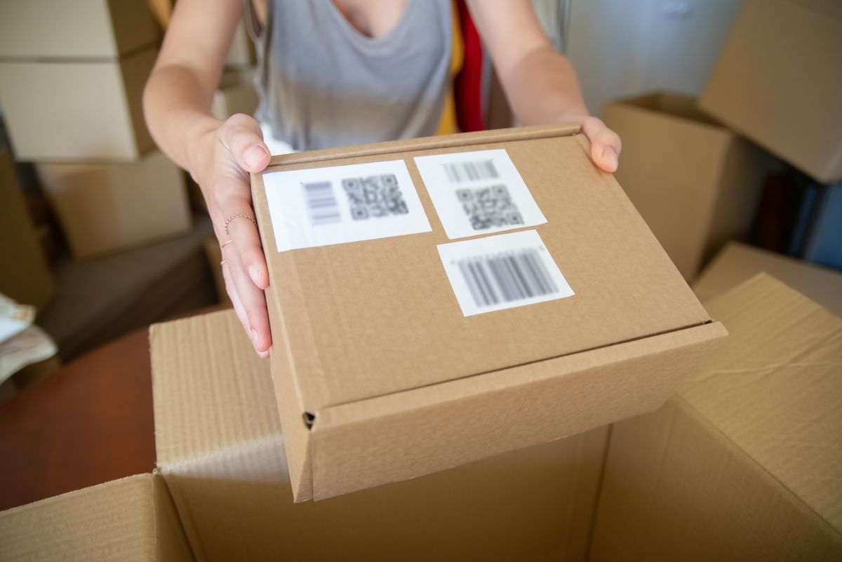 A parcel with barcode labels being checked