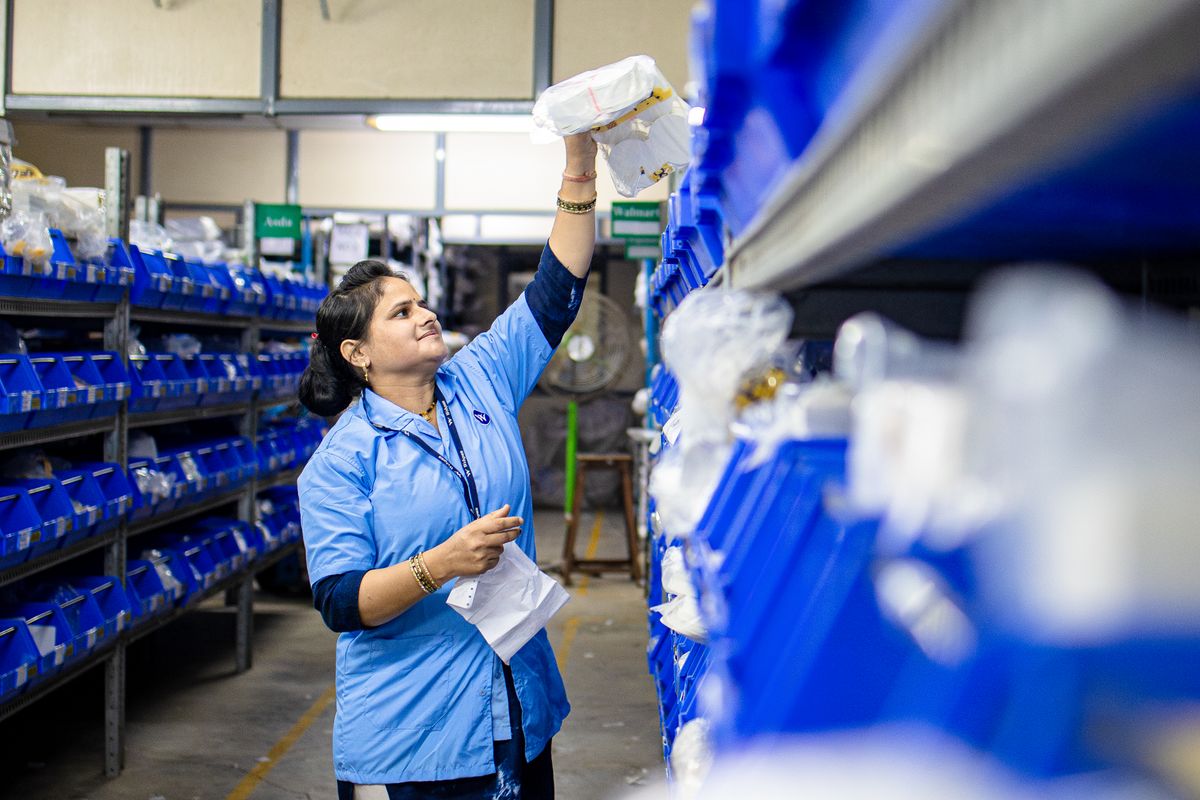 Stock being organised on warehouse shelving